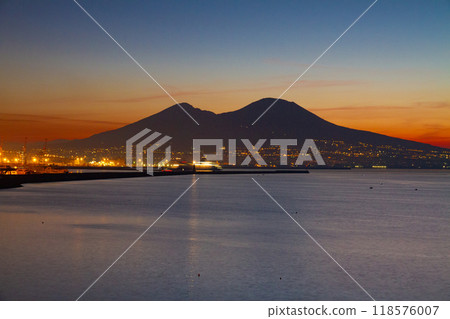 Naples, Campania, Republic of Italy, Southern Europe. Mount Vesuvius at dawn over the Bay of Naples from Santa Lucia. Naples, Campania, Republic of Italy, Southern Europe. Mount Vesuvius at dawn over the Bay of Naples from Santa Lucia. 118576007