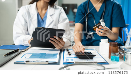 Doctors use a service fee calculator to save money on health insurance, drug cost concepts. 118576173