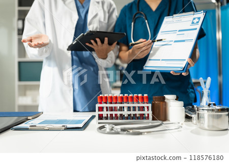 Medical team working on digital tablet healthcare doctor technology tablet using computer analyzed the results of medical reports at the hospital. 118576180