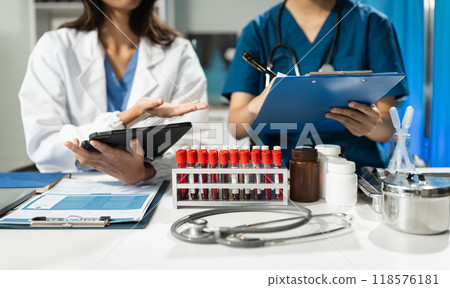 Medical team working on digital tablet healthcare doctor technology tablet using computer analyzed the results of medical reports at the hospital. Medical team working on digital tablet healthcare doctor technology tablet using computer analyzed the results of medical reports at the hospital. 118576181