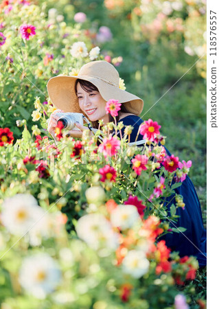 A woman shooting flowers 118576557