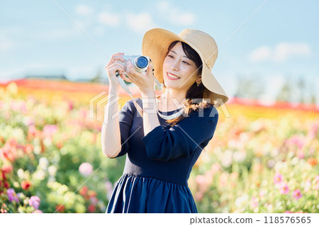 A woman shooting flowers A woman shooting flowers 118576565