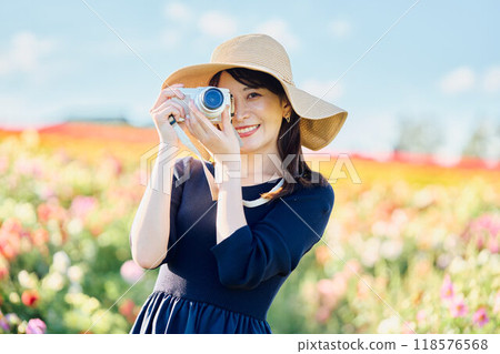 A woman shooting flowers A woman shooting flowers 118576568