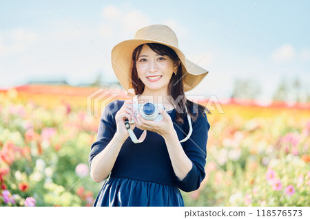 A woman shooting flowers A woman shooting flowers 118576573
