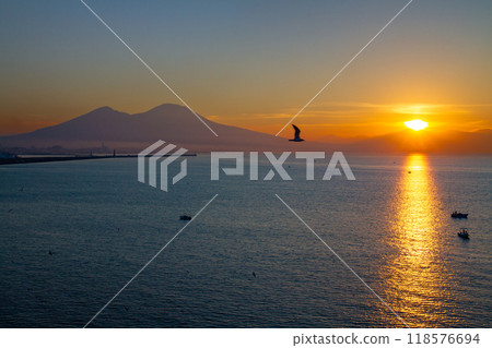 Southern Europe, Italy, Campania, Naples, Bay of Naples, Mount Vesuvius and the Morning Light Path at Sunrise from Santa Lucia 118576694
