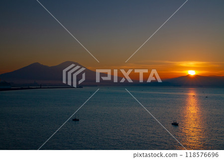 Southern Europe, Italy, Campania, Naples, Bay of Naples, Mount Vesuvius and the Morning Light Path at Sunrise from Santa Lucia Southern Europe, Italy, Campania, Naples, Bay of Naples, Mount Vesuvius and the Morning Light Path at Sunrise from Santa Lucia 118576696