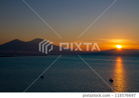 Southern Europe, Italy, Campania, Naples, Bay of Naples, Mount Vesuvius and the Morning Light Path at Sunrise from Santa Lucia 118576697