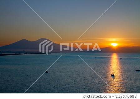 Southern Europe, Italy, Campania, Naples, Bay of Naples, Mount Vesuvius and the Morning Light Path at Sunrise from Santa Lucia 118576698