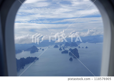 A breathtaking view of the vast ocean as seen from an airplane window A breathtaking view of the vast ocean as seen from an airplane window 118576905