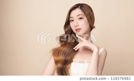 Beautiful young asian woman with clean fresh skin on beige background, Face care, Facial treatment, Cosmetology, beauty and spa, Asian women portrait. 118576981