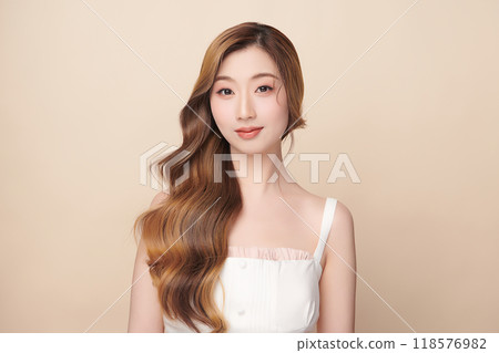 Beautiful young asian woman with clean fresh skin on beige background, Face care, Facial treatment, Cosmetology, beauty and spa, Asian women portrait. 118576982
