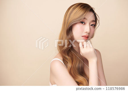 Beautiful young asian woman with clean fresh skin on beige background, Face care, Facial treatment, Cosmetology, beauty and spa, Asian women portrait. 118576986
