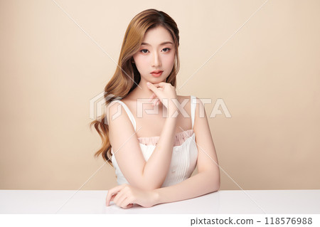 Beautiful young asian woman with clean fresh skin on beige background, Face care, Facial treatment, Cosmetology, beauty and spa, Asian women portrait. 118576988
