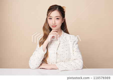 Beautiful young asian woman with clean fresh skin on beige background, Face care, Facial treatment, Cosmetology, beauty and spa, Asian women portrait. 118576989