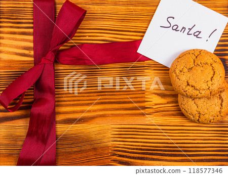 A note for Sanita with a red bow and cookies Christmas concept 118577346
