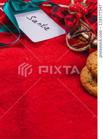 note to Santa on a red background with bells and cookies, Christmas concept 118577347