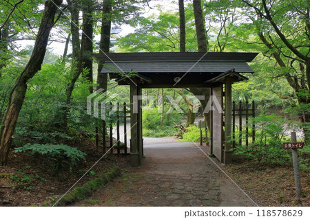 Mon or Japanese gate on top of the mountain at the Usui mountain pass in Karuizawa in the Japanese Alps of Nagano Japan on the broderline between Nagano and Gunma prectures. Mon or Japanese gate on top of the mountain at the Usui mountain pass in Karuizawa in the Japanese Alps of Nagano Japan on the broderline between Nagano and Gunma prectures. 118578629