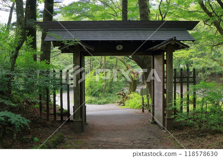 Mon or gate on top of the mountain at the Usui mountain pass in Karuizawa in the Japanese Alps of Nagano Japan on the broderline between Nagano and Gunma prectures. Mon or gate on top of the mountain at the Usui mountain pass in Karuizawa in the Japanese Alps of Nagano Japan on the broderline between Nagano and Gunma prectures. 118578630