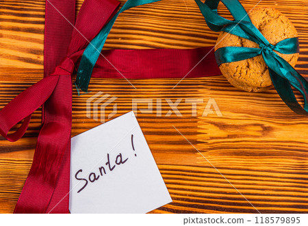 Note for Ambulance with red and green bow and cookies Christmas concept 118579895