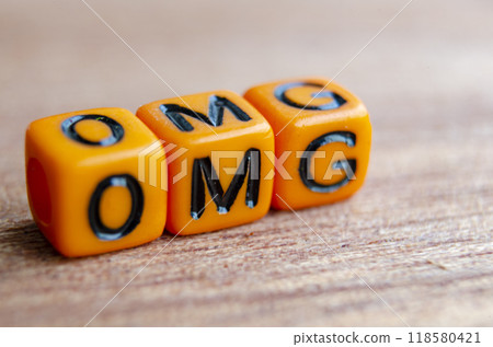 OMG text represent Oh My Gosh on wooden table. 118580421