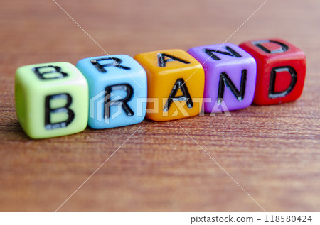 Close up of Brand text on wooden table. Close up of Brand text on wooden table. 118580424