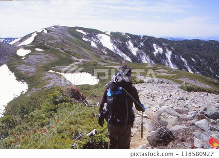 Walking along the ridge 118580927