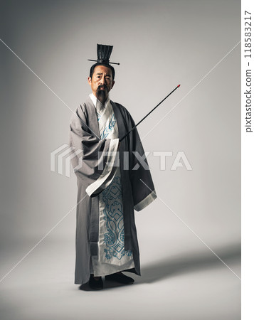 A scene where a Chinese historical figure, such as Zhuge Liang from the Romance of the Three Kingdoms, is giving a lecture at a seminar while holding a pointing stick A scene where a Chinese historical figure, such as Zhuge Liang from the Romance of the Three Kingdoms, is giving a lecture at a seminar while holding a pointing stick 118583217