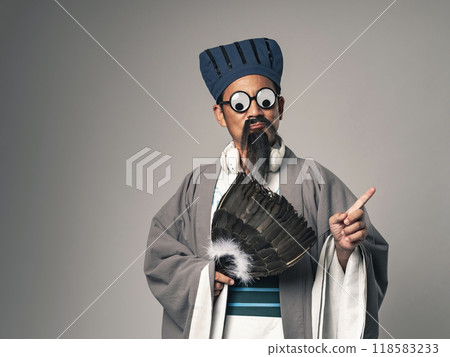 A scene of a historical Chinese military strategist, such as Zhuge Liang from the Romance of the Three Kingdoms, having fun at a party 118583233