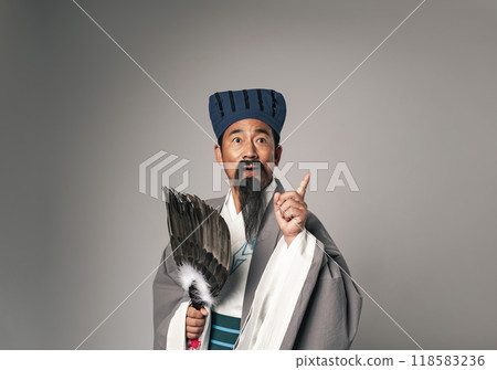 A scene where a historical Chinese military strategist, such as Zhuge Liang from the Romance of the Three Kingdoms, came up with an idea A scene where a historical Chinese military strategist, such as Zhuge Liang from the Romance of the Three Kingdoms, came up with an idea 118583236