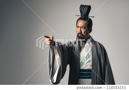 A scene where a historical figure from China, such as Zhuge Liang from the Romance of the Three Kingdoms, gives orders 118583251