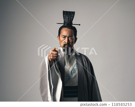 A scene where a historical figure from China, such as Zhuge Liang from the Romance of the Three Kingdoms, gives orders A scene where a historical figure from China, such as Zhuge Liang from the Romance of the Three Kingdoms, gives orders 118583253