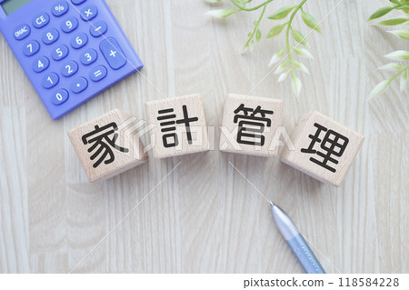 Image of household management: calculator and pen 118584228