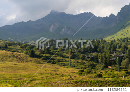 Scenic Mountain Landscape with Cable Cars and Lush Greenery 118584231