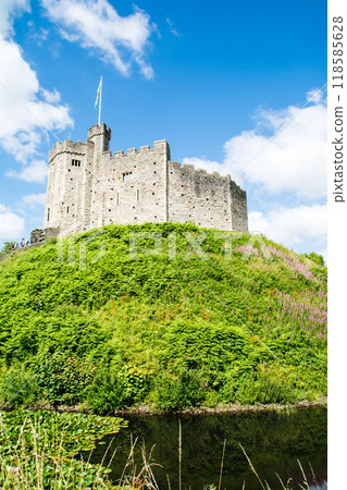 Historic Cardiff Castle, built of brick and stone and standing on a small hill in Cardiff, the capital of Wales Historic Cardiff Castle, built of brick and stone and standing on a small hill in Cardiff, the capital of Wales 118585628