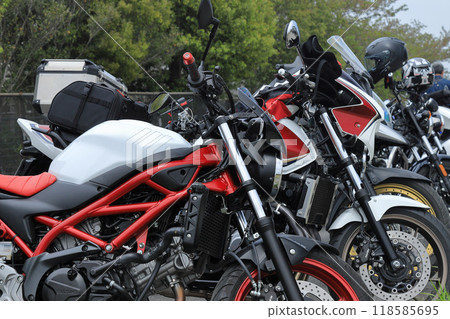 Bikes lined up in a parking lot Bikes lined up in a parking lot 118585695
