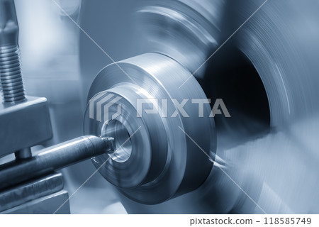 The CNC lathe machine boring cut process the cast iron parts. 118585749