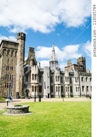 A historic brick and stone building in the grounds of Cardiff Castle under bright sunlight in Cardiff, the capital of Wales. A historic brick and stone building in the grounds of Cardiff Castle under bright sunlight in Cardiff, the capital of Wales. 118585764