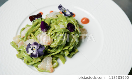 Green Spaghetti Dish With Eatable Flowers  118585990