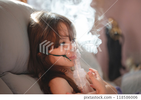 Portrait of little girl with nebulizer Portrait of little girl with nebulizer 118586006