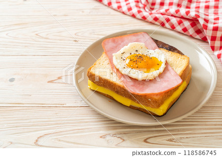 bread toasted cheese topped ham and fried egg with pork sausage 118586745