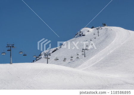 Snowy slopes in ski resort Gudauri, Georgia. Caucasus Mountains Snowy slopes in ski resort Gudauri, Georgia. Caucasus Mountains 118586895
