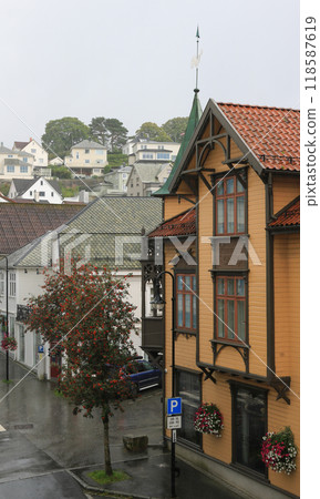 Facade of an old hotel in Egersund, Norway, on a rainy day. Facade of an old hotel in Egersund, Norway, on a rainy day. 118587619