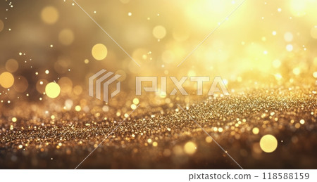 Sparkling golden particles shimmering gently in warm light over a dark surface at dusk 118588159