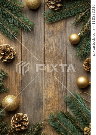 Festive holiday decorations with golden ornaments and pinecones on a rustic wooden background 118588336