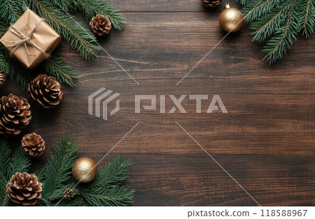 Festive pine branches with ornaments and pine cones arranged on a dark wooden surface Festive pine branches with ornaments and pine cones arranged on a dark wooden surface 118588967