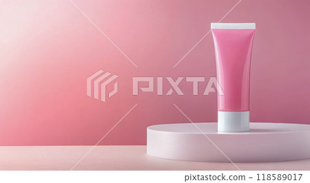 A close-up of a pink cosmetic tube placed on a soft pink surface with an elegant gradient background 118589017