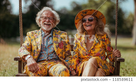 A man and a woman are joyfully sitting together on a swing 118589611