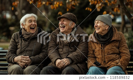 Three elderly individuals are sitting on a park bench and laughing joyfully Three elderly individuals are sitting on a park bench and laughing joyfully 118589832