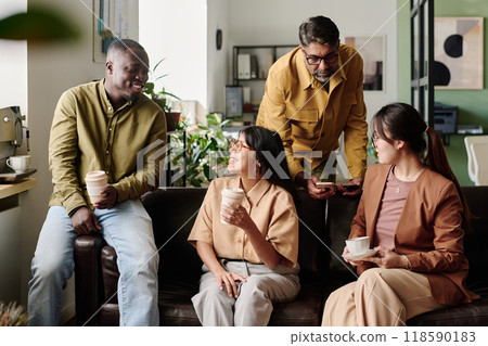 Colleagues Having Coffee in Modern Office Setting Colleagues Having Coffee in Modern Office Setting 118590183