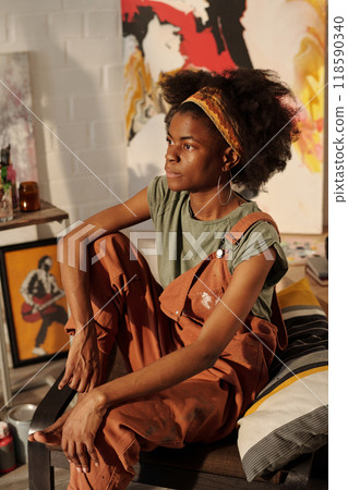 Relaxing in Cozy Living Room with Artistic Background Relaxing in Cozy Living Room with Artistic Background 118590340